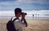 Dave in taking a picture on the beach in Surfers
